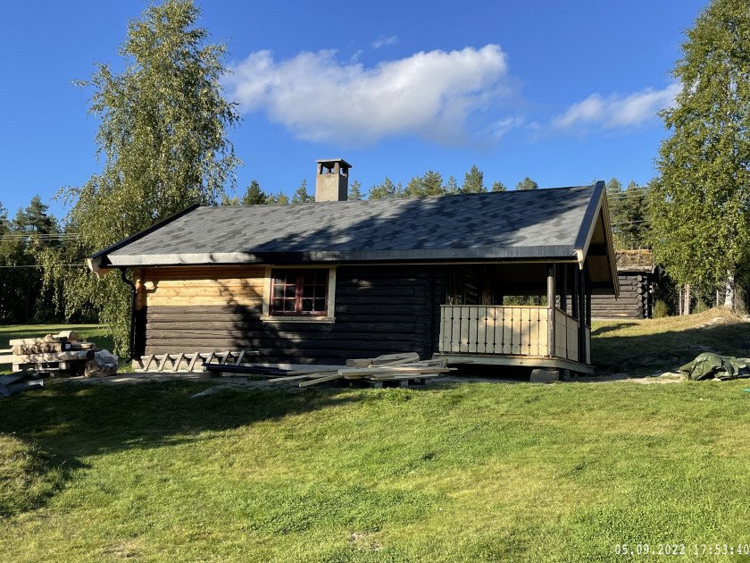 Tradisjonell laftet tømmerhytte bygget av Olastuen Bygg